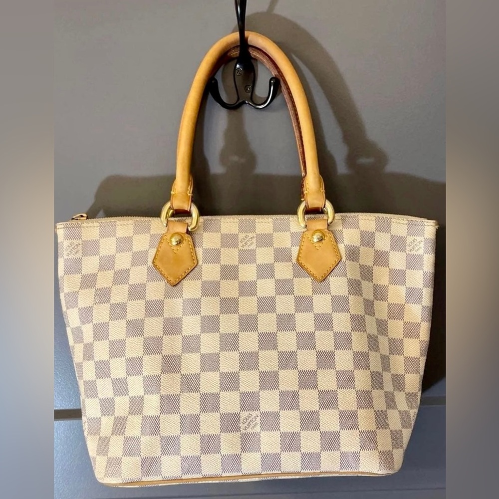 Louis Vuitton handbag, pre owned.  Also please see matching wallet in my closet!